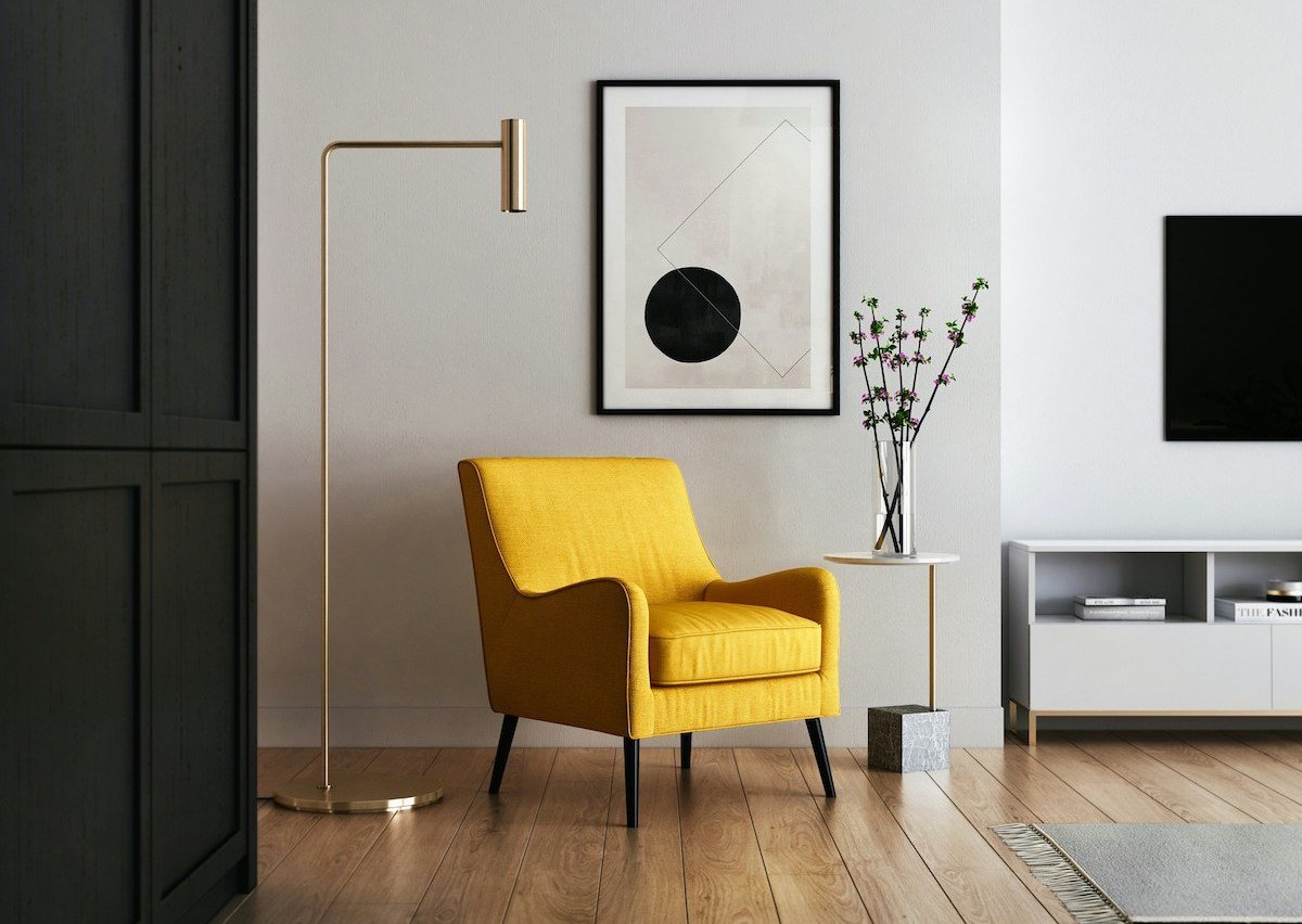 Yellow chair in front of modern art